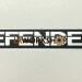 BTR1045 - "Defender" decal, front panel, black on silver